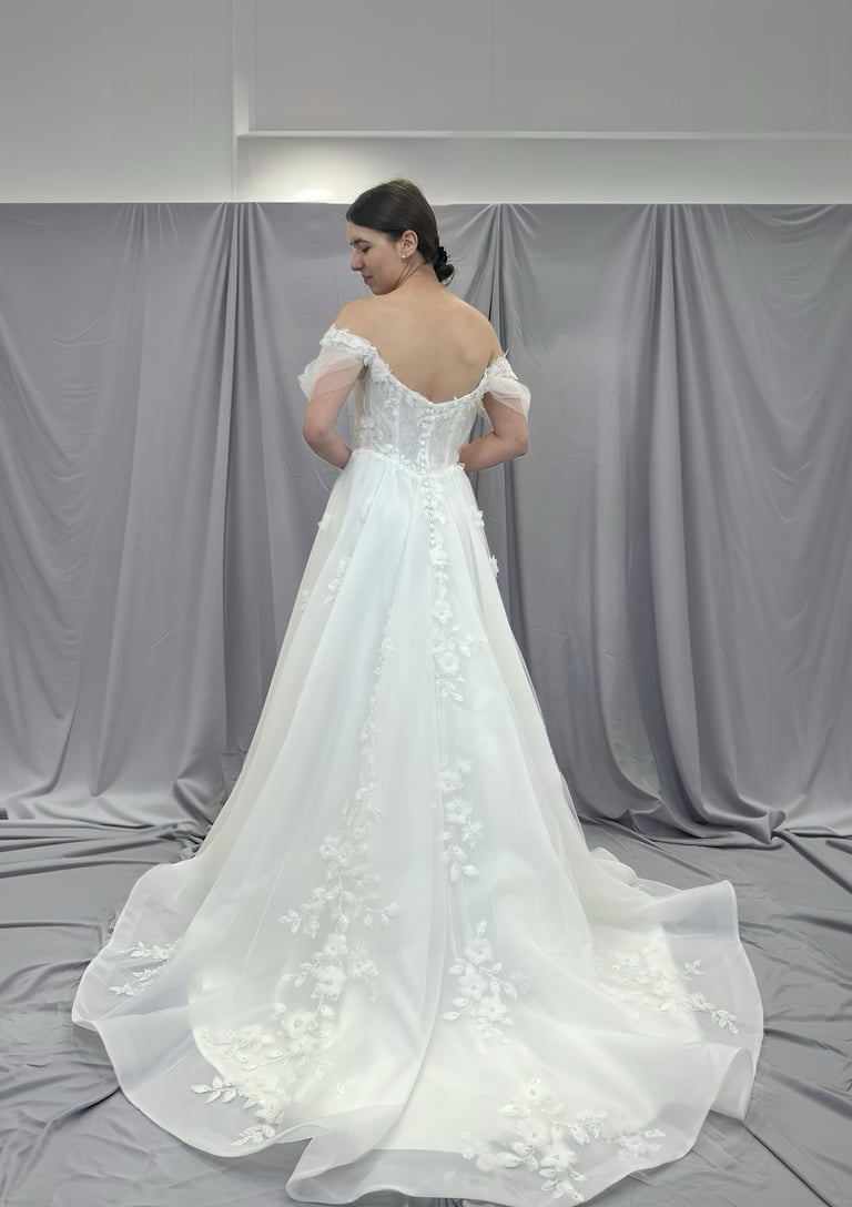 a woman in a wedding dress with a white dress