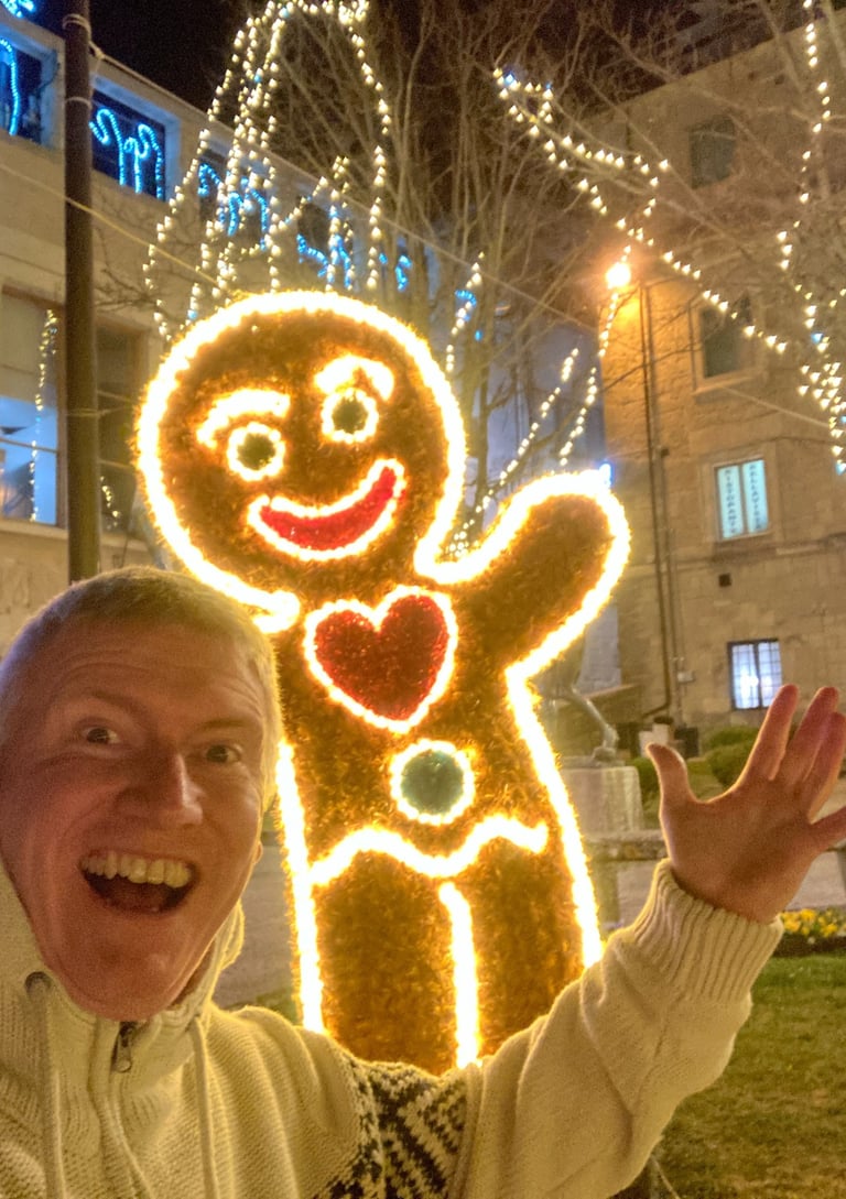 Silly selfie with waving ginger bread man in San Marino at Christmas and New Year