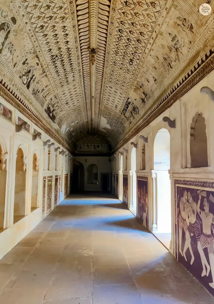 ainted gallery of Lakshmi Temple, Orchha, featuring mythological frescoes and Bundela artistry.