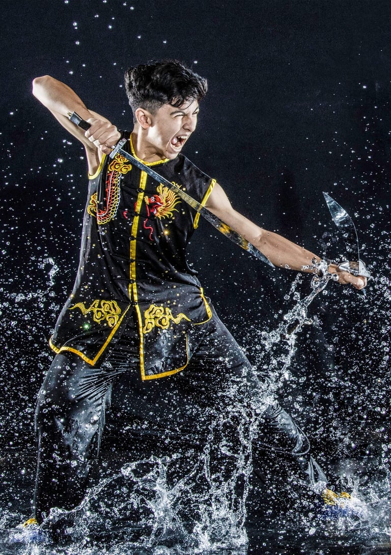 Las Vegas martial artist yelling in a fighting pose with double broadswords