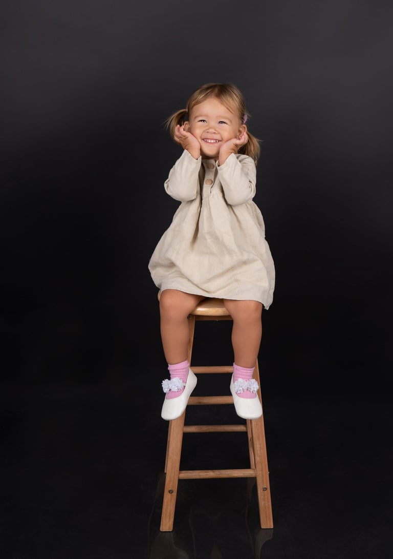 Smiling baby capturing a precious moment in a beautifully styled photoshoot.
