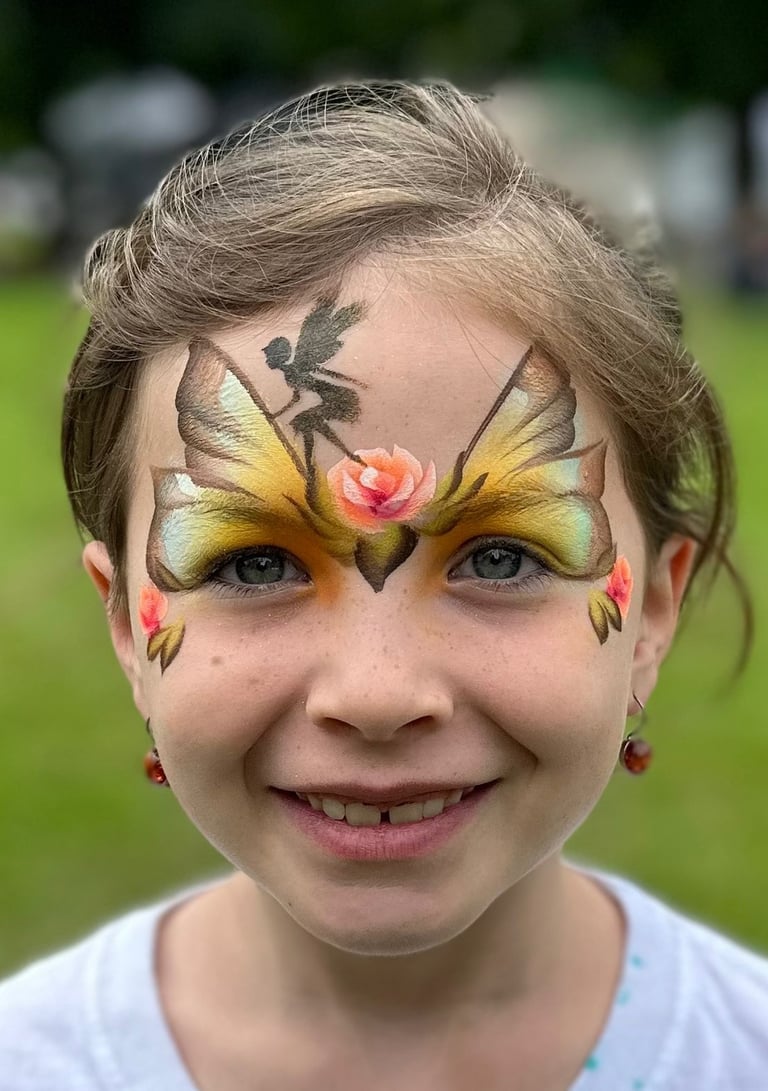 Young girl with face painting of butterfly wings, a fairy and roses. Fairy princess painting