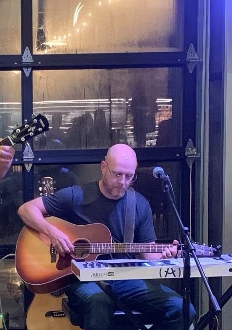 William Finn from Finn's Echo performing in front of live audience