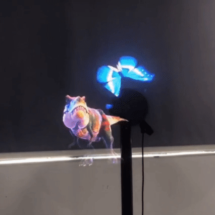 A high-tech 3D hologram fan projector displaying a glowing blue butterfly and a Tyrannosaurus Rex.