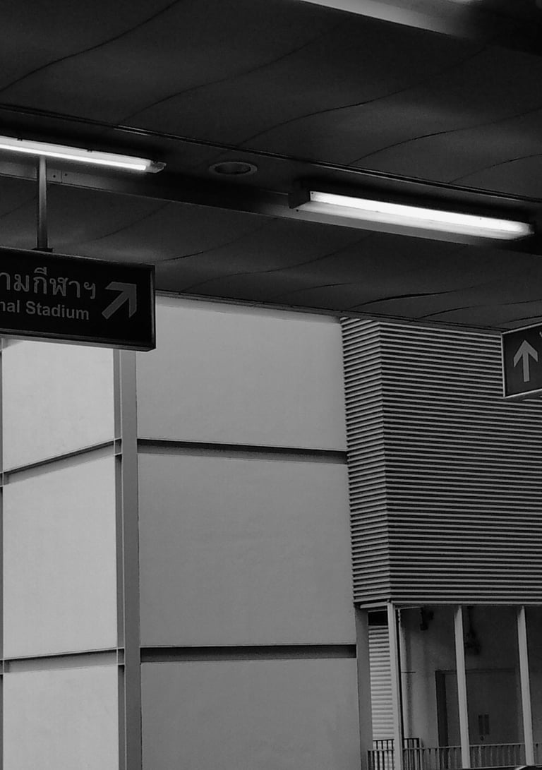 a black and white photo of a train station