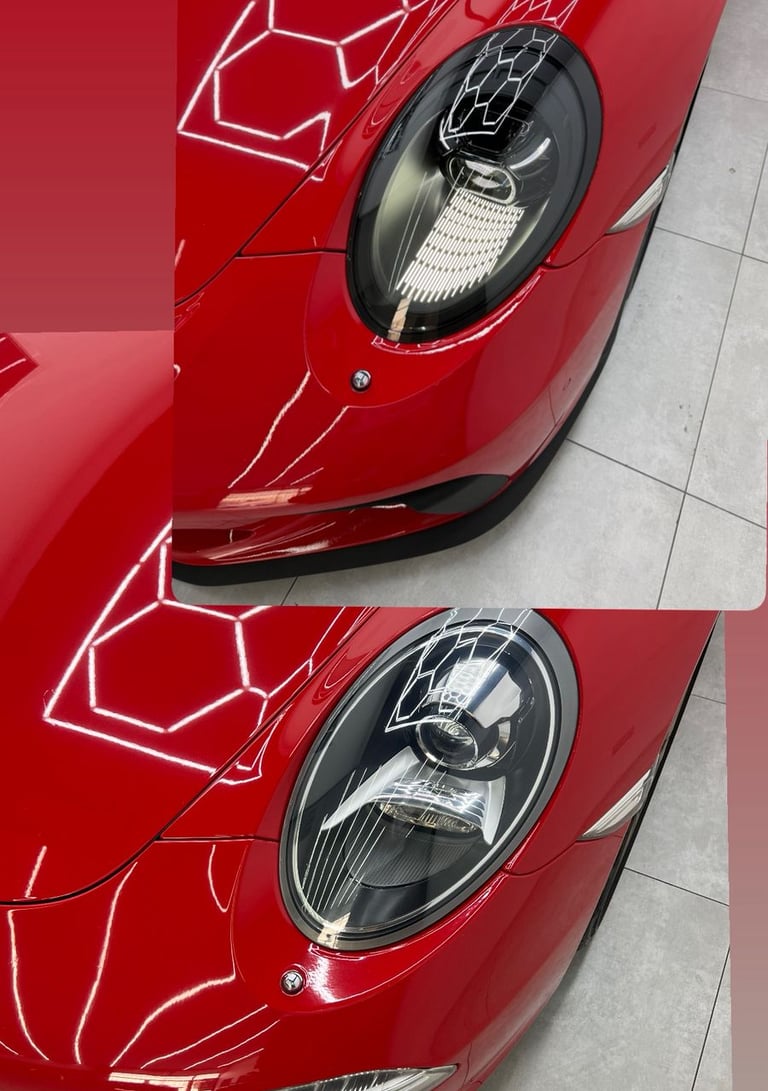 Close-up of a red luxury sports car's LED headlights with honeycomb light reflections on the hood.
