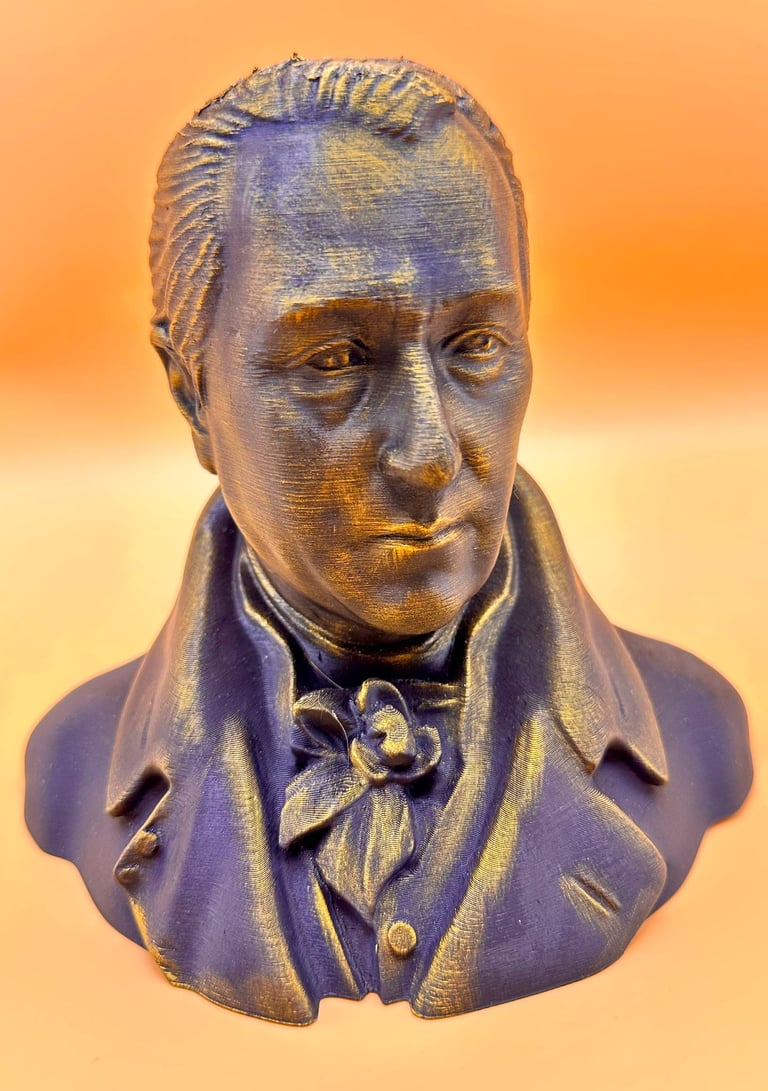 3D printed bust of George Washington with a metallic bronze and purple finish on an orange background.