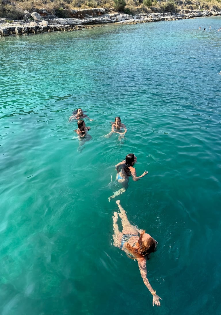 people swimming from boat tour Saranda