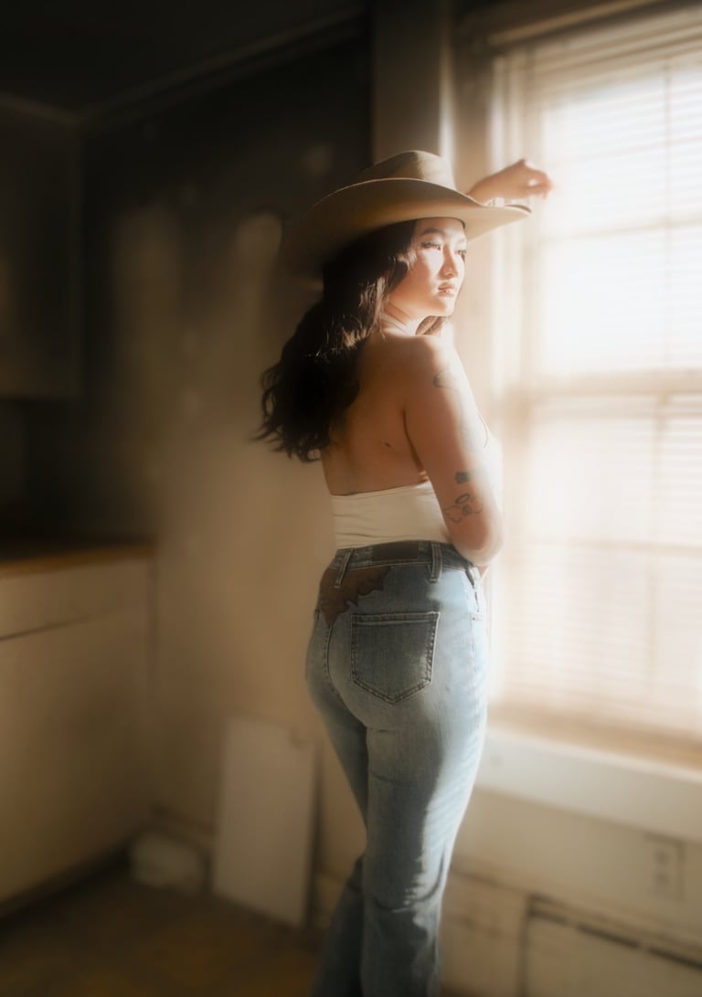 a woman in a white top and jeans 
