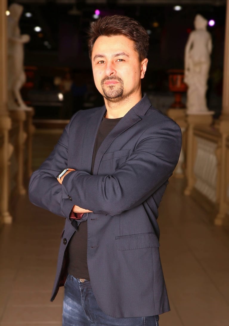 feelee wearing a suit jacket and jeans looking really smart