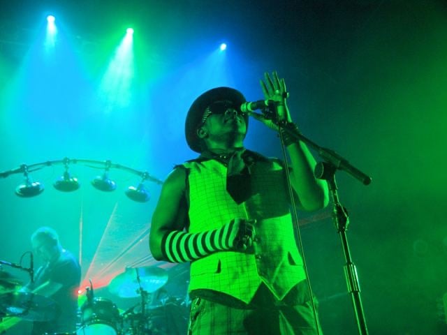 singer onstage holding microphone