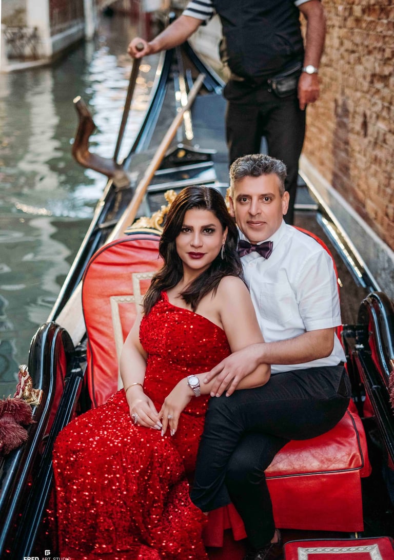 Couple by gondolas in Venice