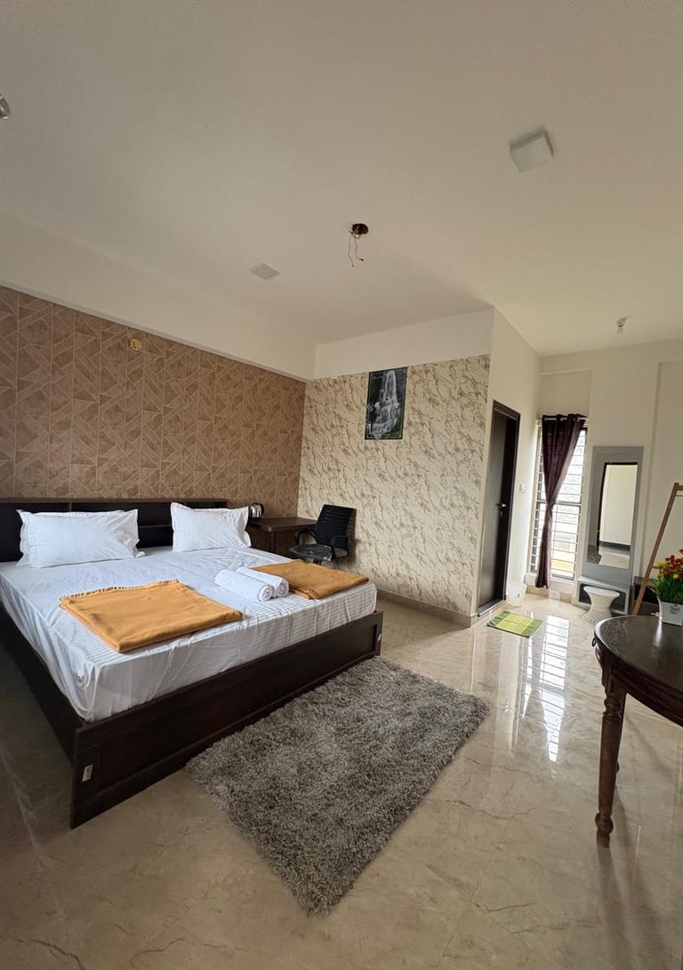 a bedroom with a bed and a desk