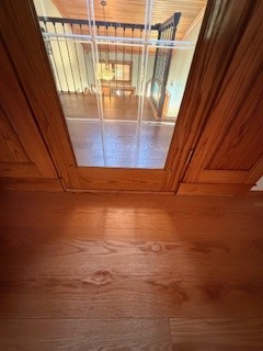 New floating wood floor mated to new hardwoods with custom transition
