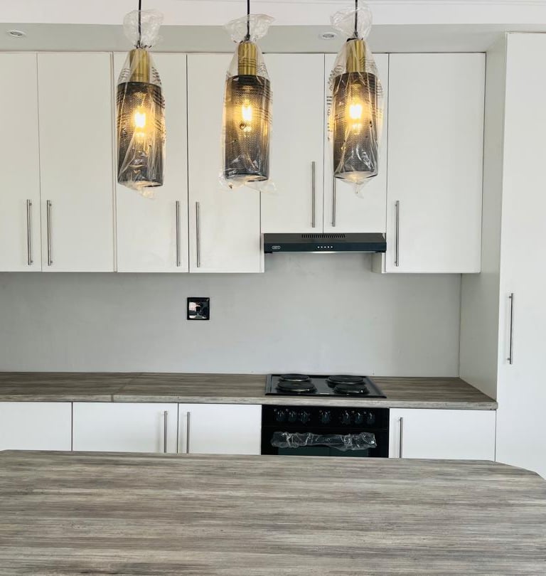 a kitchen with a stove top oven and a stove top oven