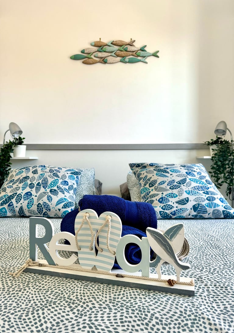 a bed with a wooden sign that says love