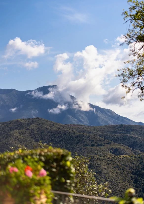 Mountain view with clouds and greenery at Finca Santa Katerina