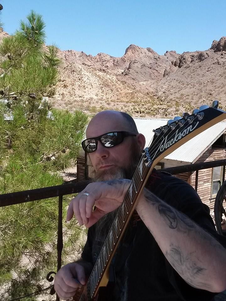 RH McClurg On Set in Ghost Town of Nelson Nevada with Guitar