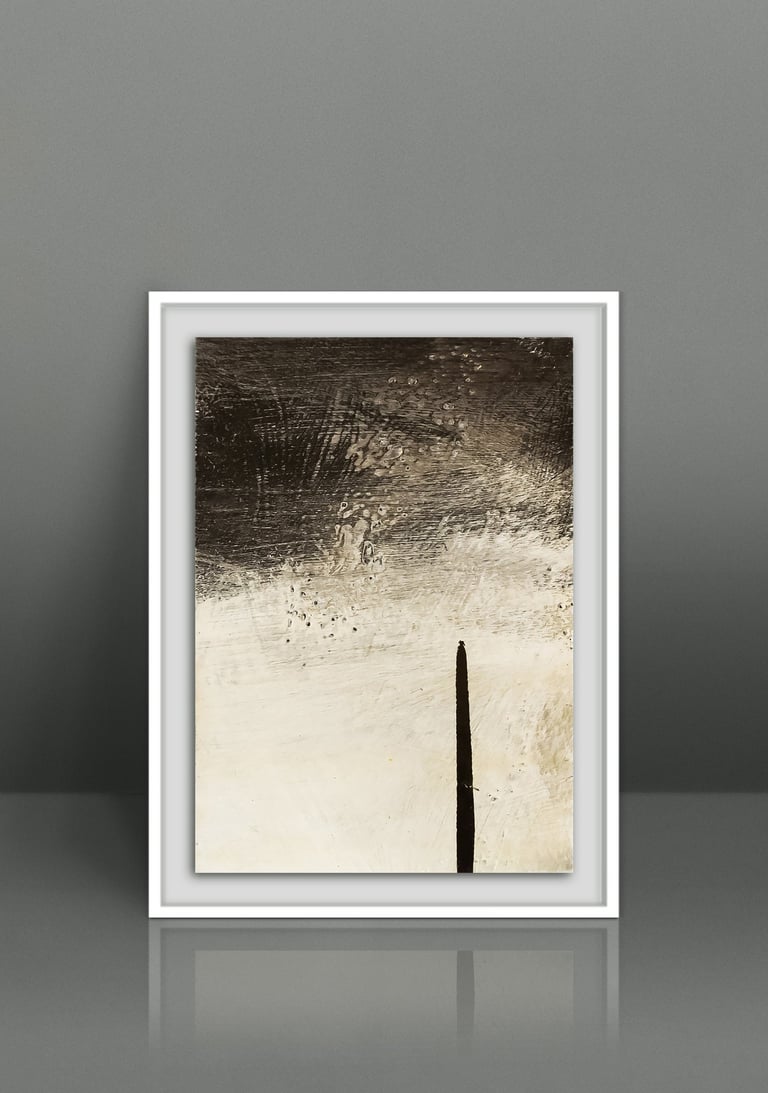 Framed minimalist abstract painting in black and white oil strokes on a grey wall.