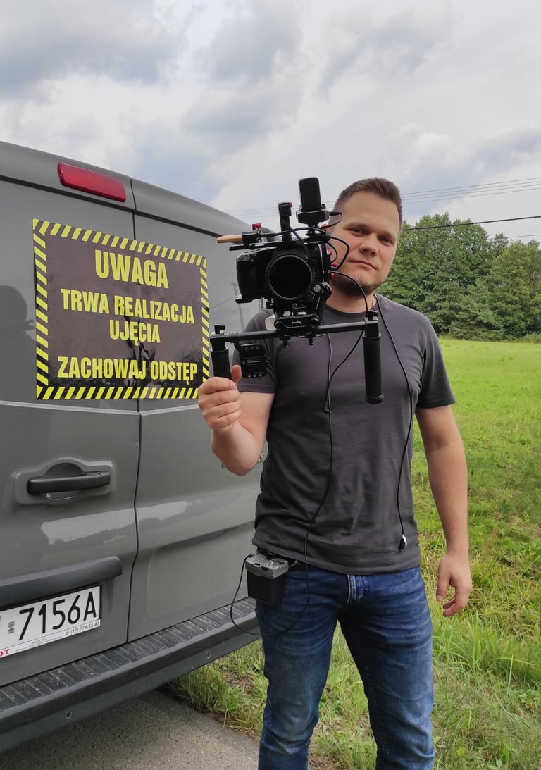 a man holding a camera and a camera