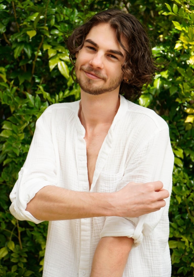 a man with a beard and a white shirt