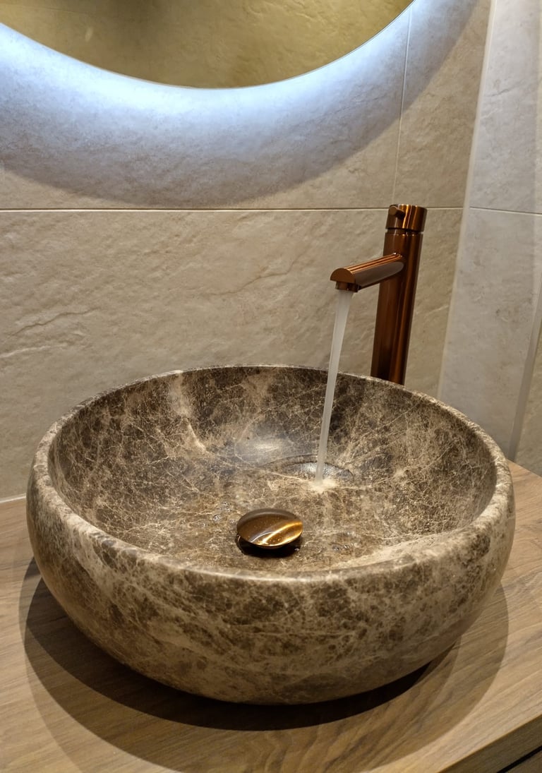 a stone sink with a faucet and a faucet faucet