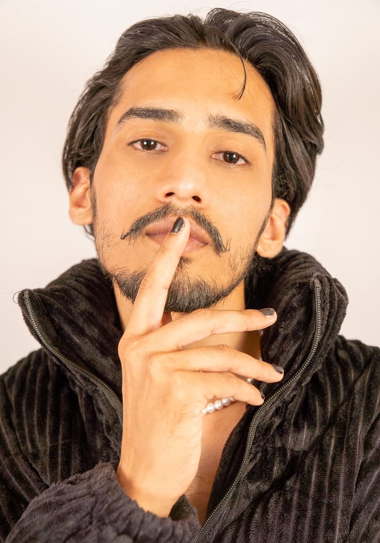 a man with a mustache and a mustache on his finger