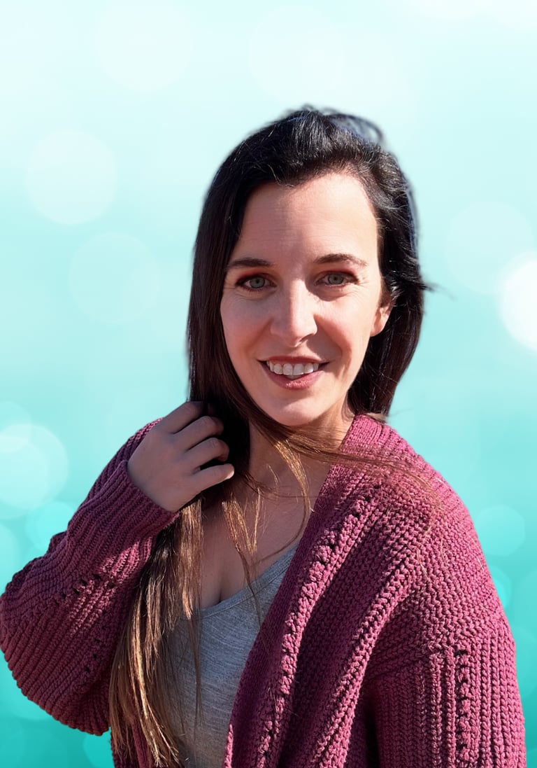 a woman in a purple sweater and a blue sky