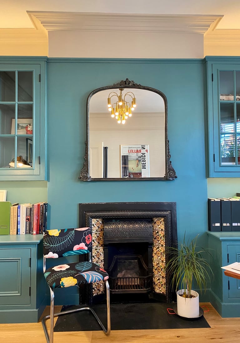 Mid century light fixture, recycled chair in home office