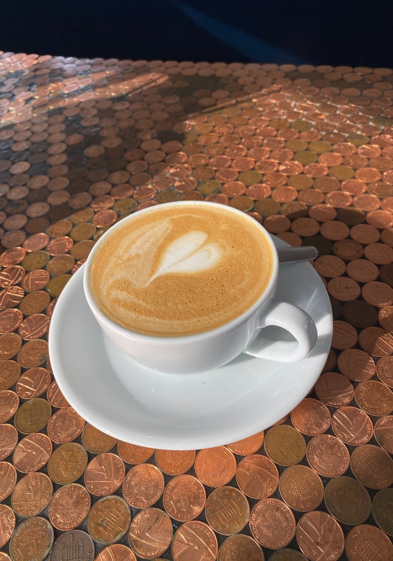 oat flat white with heart latte art served at the ark northampton vegan cafe