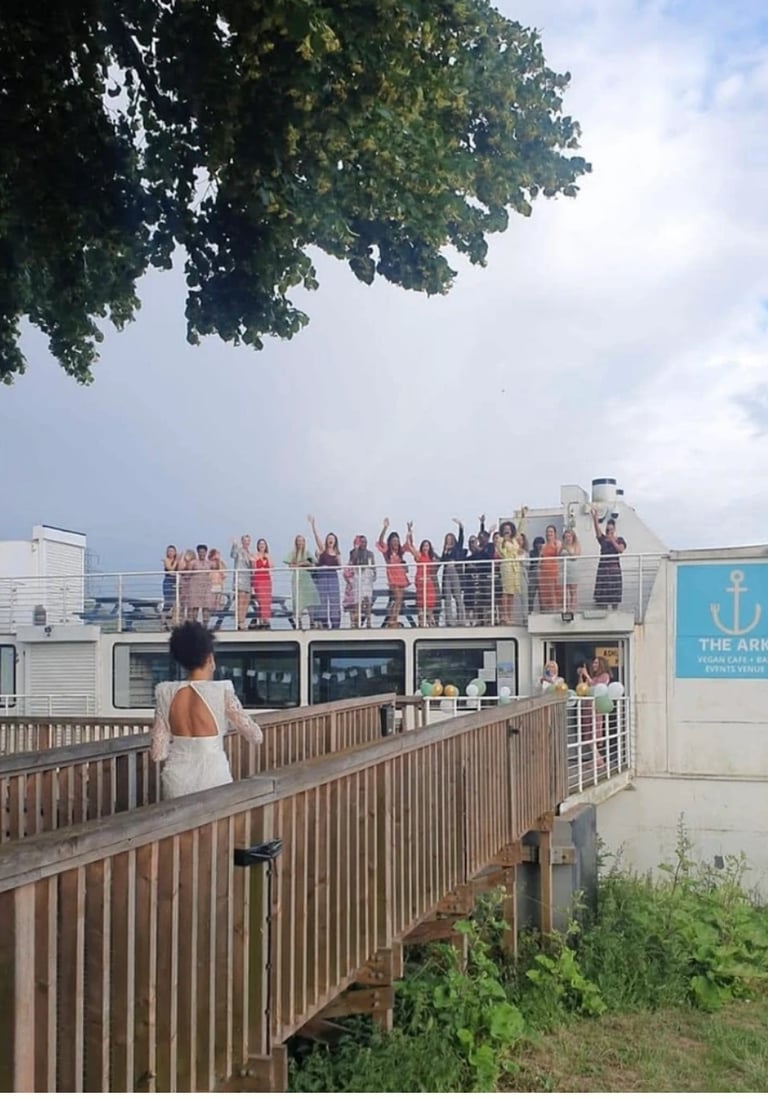women are welcoming a guest on board the ark northampton as she arrives to her hen party