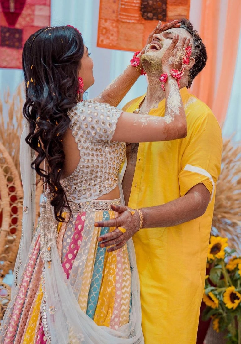 a man and woman in a yellow and white dress