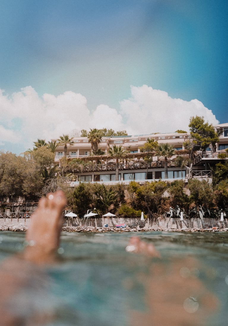 Gloria Maris Hotel Suites and Villa from the sea, boat tour floating swimming location