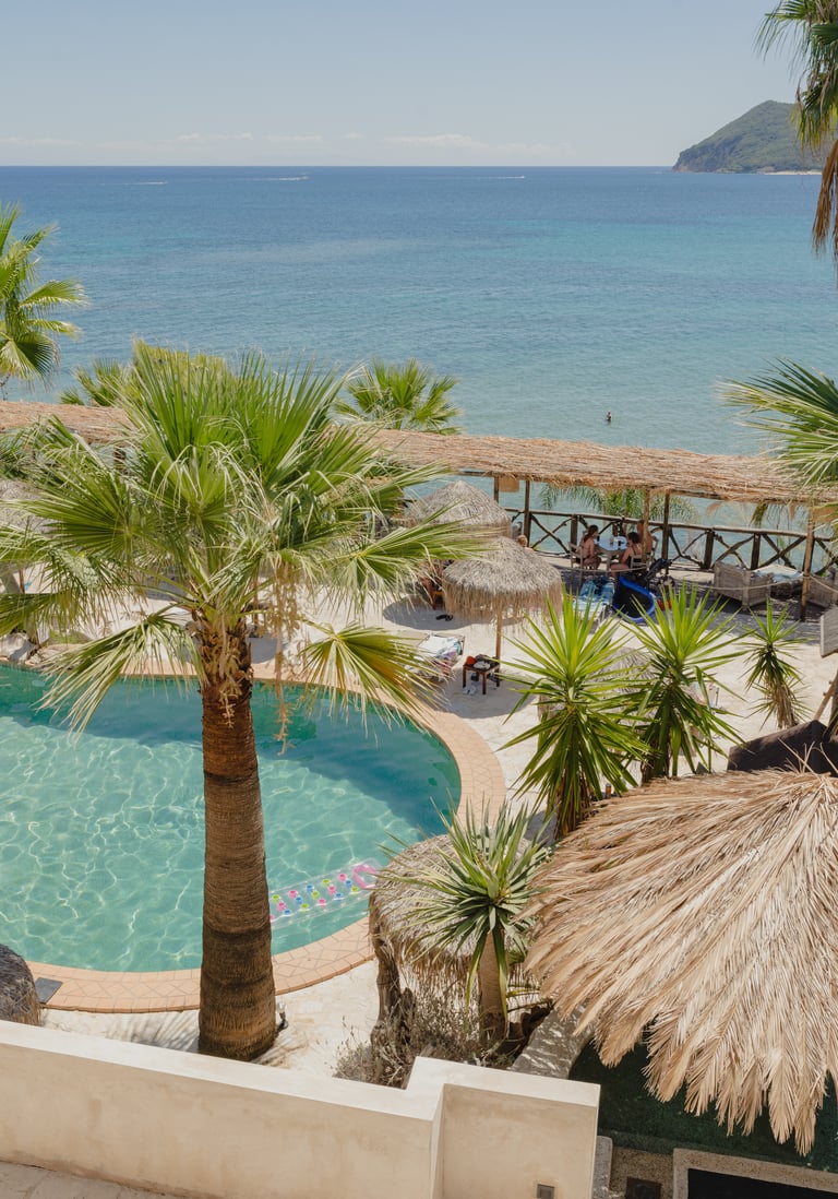 Gloria Maris Hotel Suites and Villa pool sun loungers breakfast