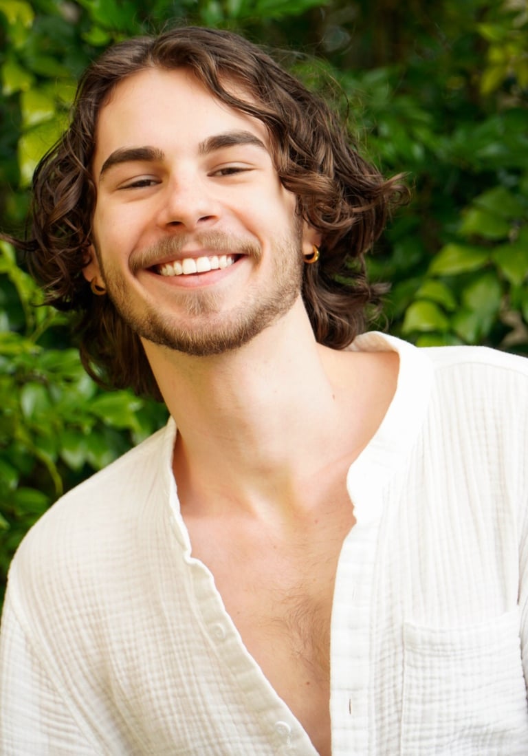 a man with a beard and a white shirt