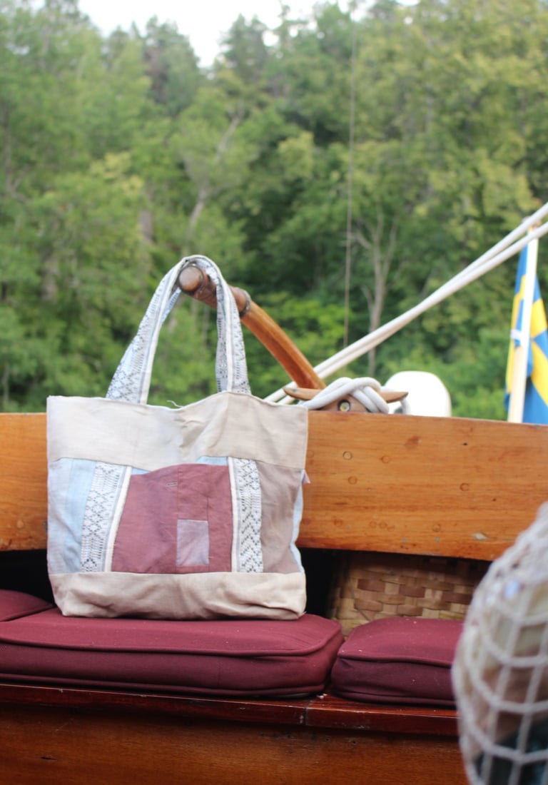 tote bag from recycled fabric during on an old wooden sailboat