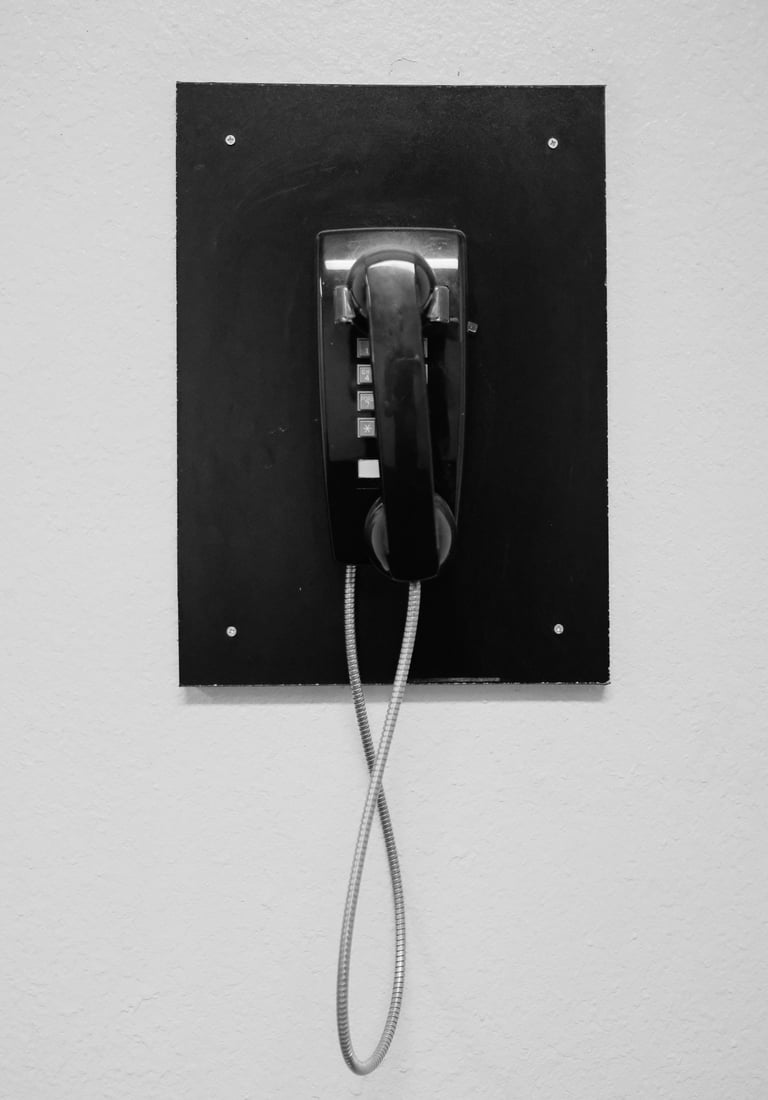 a telephone attached to the wall