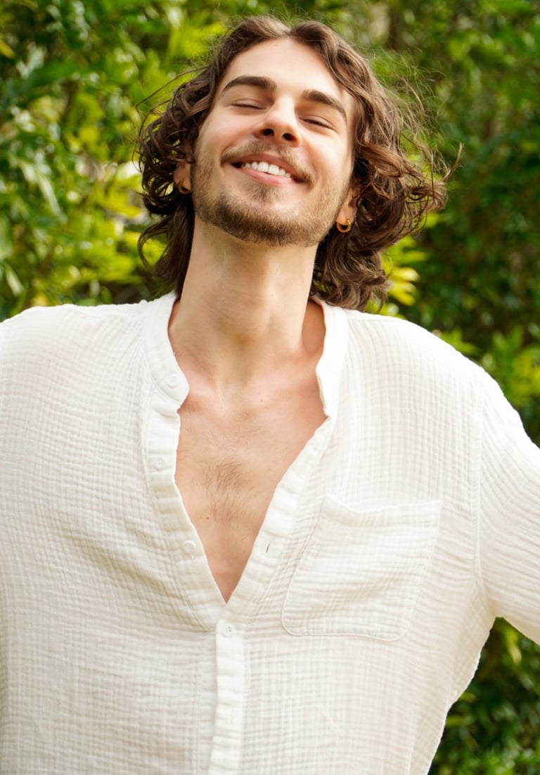 a man with a beard and a white shirt