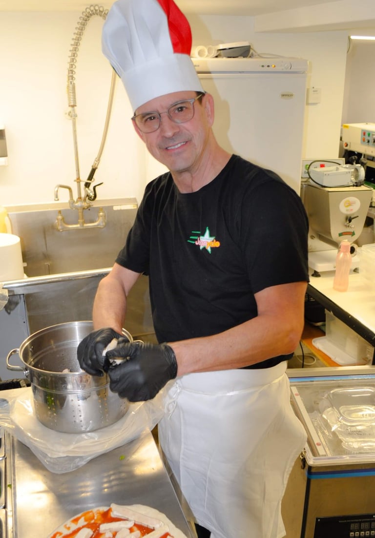 a man in a chef hat and chef's hat