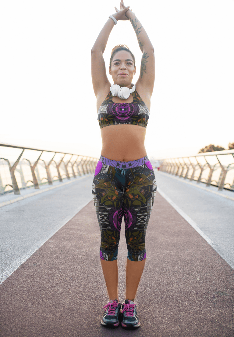 a woman in a sports bra top and headphones