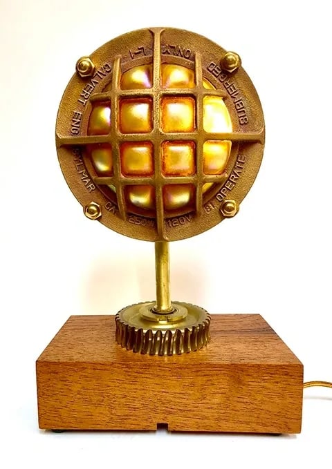 Custom light made from brass underwater cage.