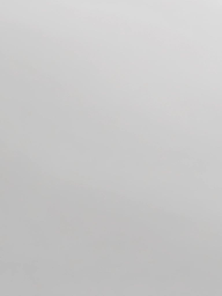 Smooth light grey matte texture surface background for minimalist interior design projects.