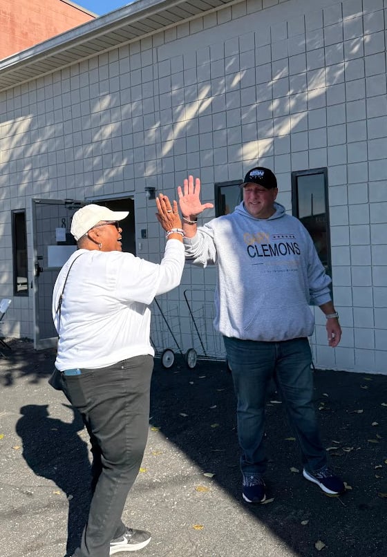 a man and woman are playing frisbee golf
