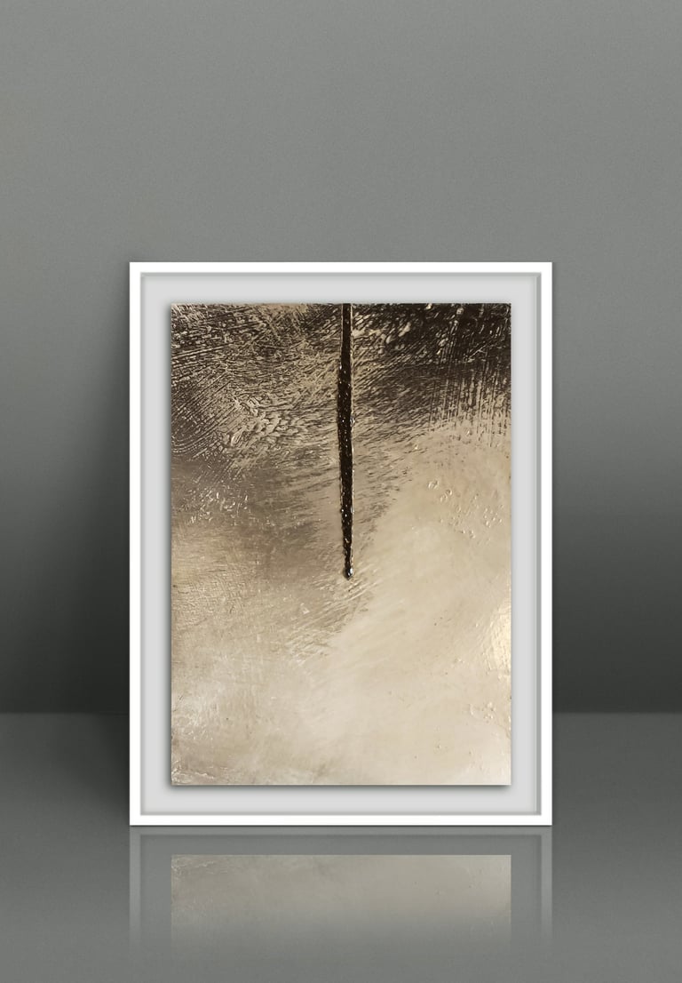 Minimalist gold and bronze abstract painting in a white frame on a grey studio background.
