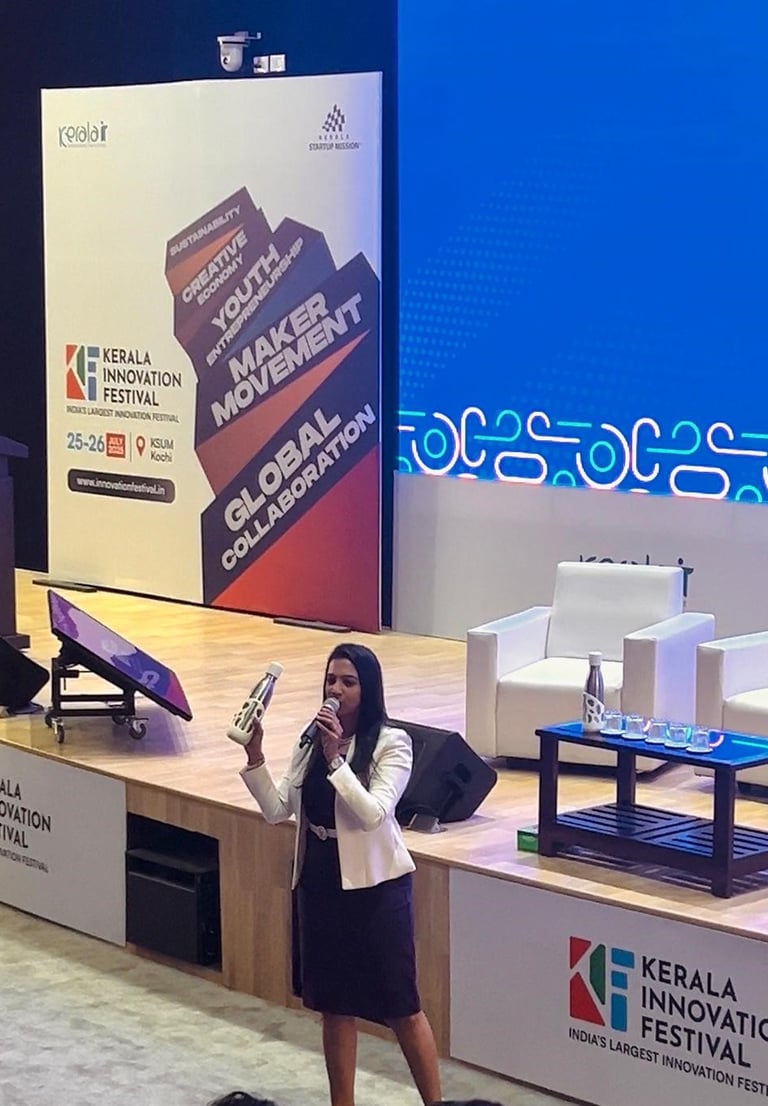 Keala innovation festival host is holding liquisip bottle