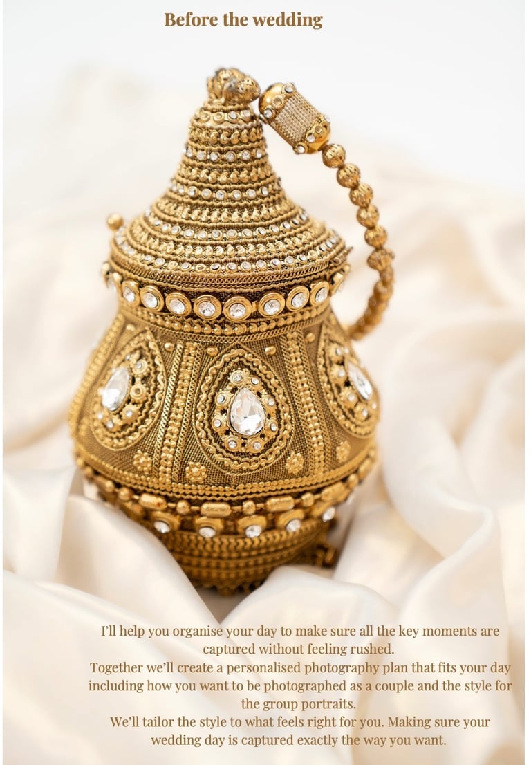gold asian bag with clear diamonds resting on gold silk fabric