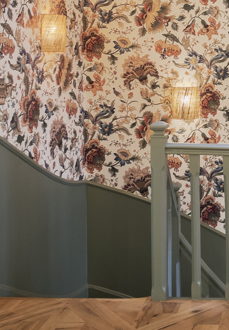 staircase with floral wallpaper