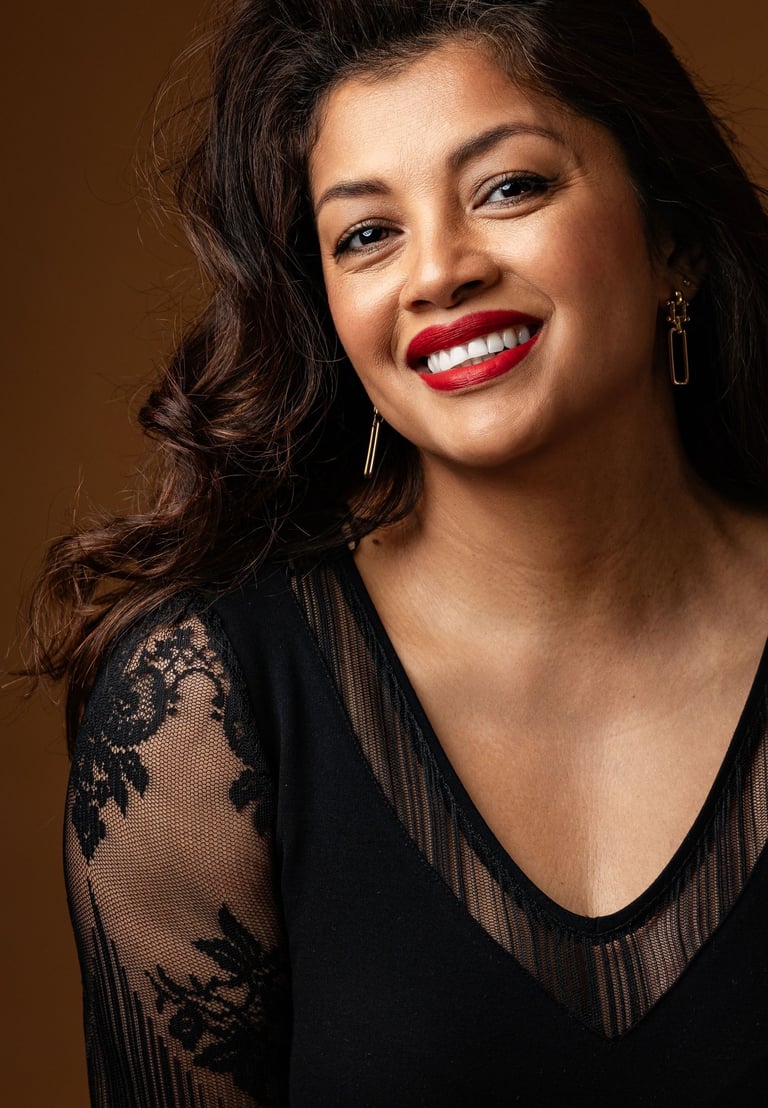 a woman with a red lipstick and a black top