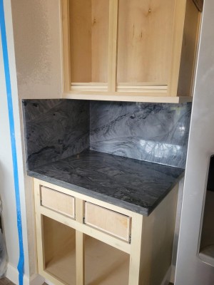 a kitchen counter top with a marble counter top