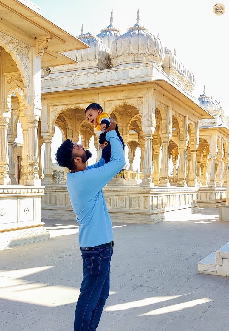 With my toddler at Devi Kund Sagar, Bikaner, surrounded by marble chhatris of royal heritage.